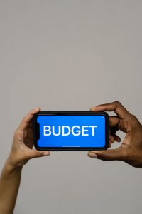 Person frustrated with a budgeting app, contrasted with a person achieving financial goals.