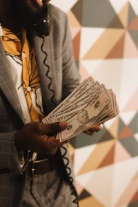 Person confidently negotiating salary with handshake.