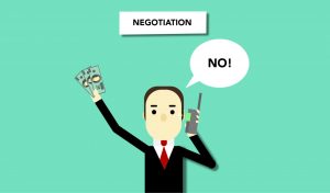 Man in suit shaking hands, symbolizing salary negotiation.