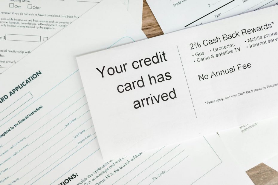 Credit card with rewards icons and a magnifying glass highlighting secrets.
