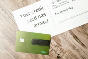 Credit card with a question mark and many rewards icons.