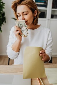 Man looks at graph showing financial growth, escaping debt.