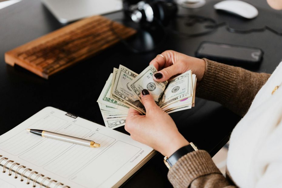 Woman celebrates financial freedom, no longer living paycheck to paycheck.